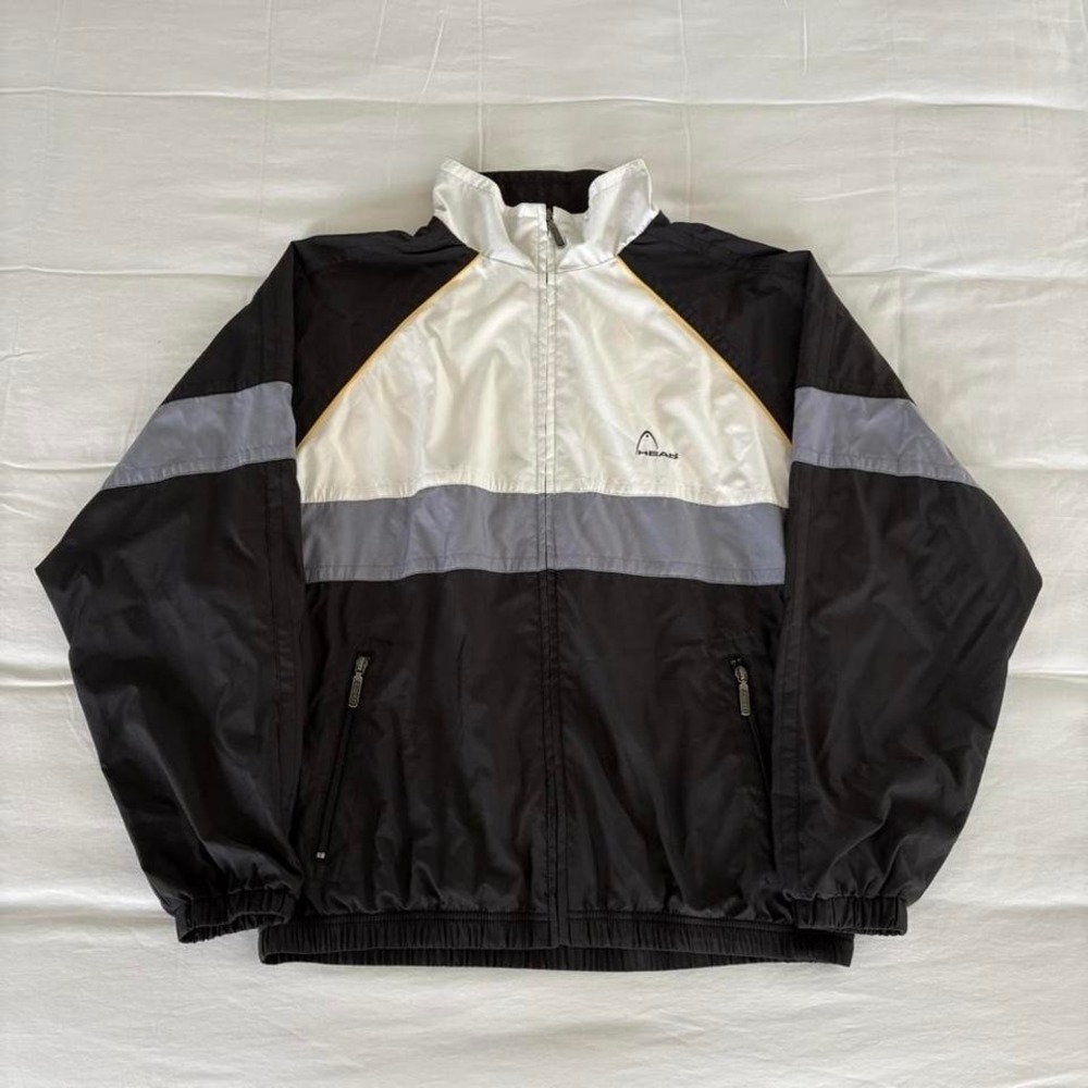 Vintage HEAD windbreaker jacket in black, white, grey, and yellow
